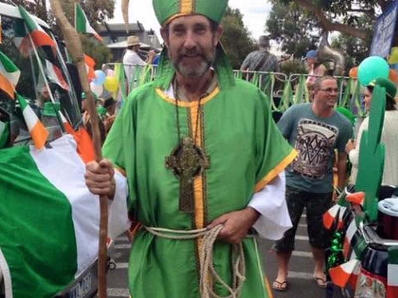 A member dressed as St Patrick leading the parade