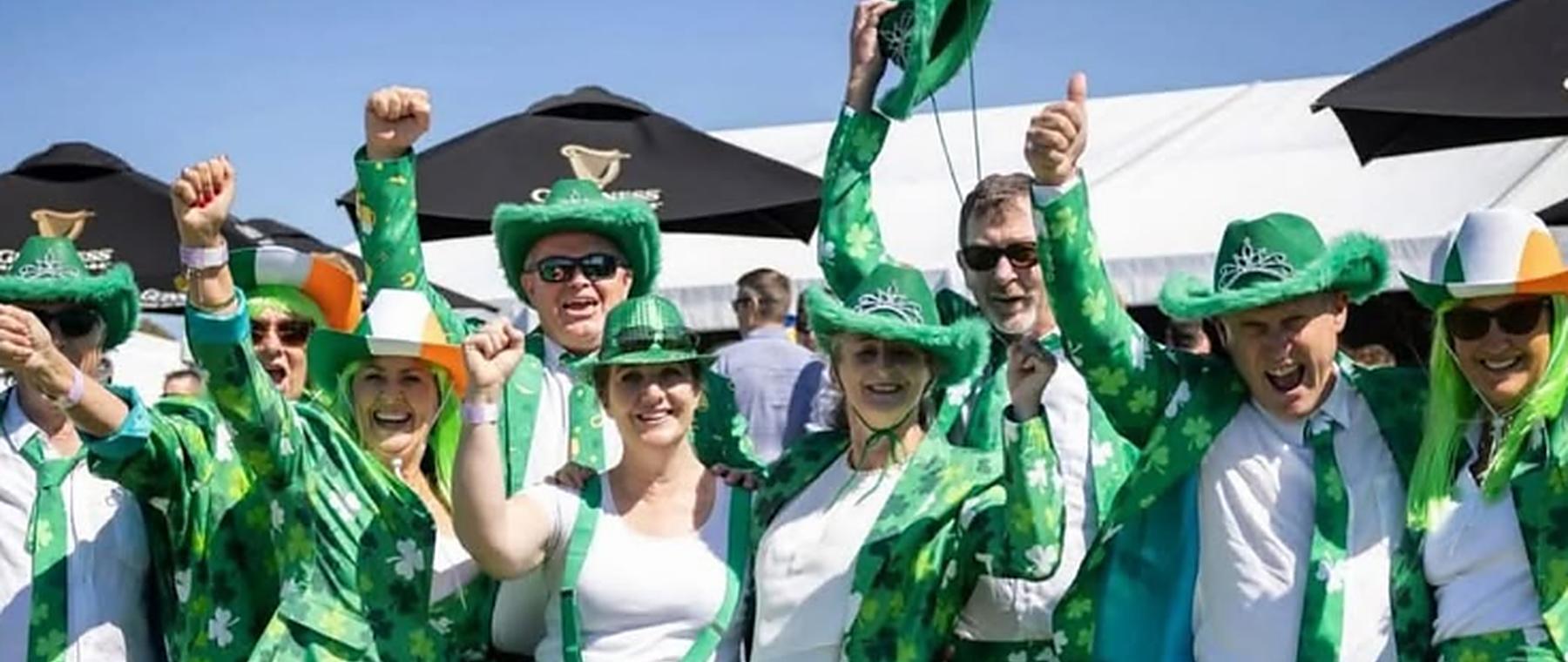 Geelong Irish Society members celebrating together in green at a St Patrick's Day race day